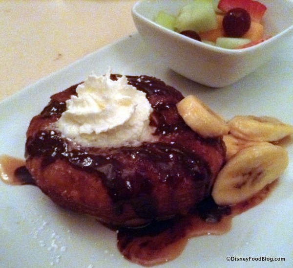 Croissant Doughnut topped with banana caramel sauce, pastry creme, and chocolate ganache