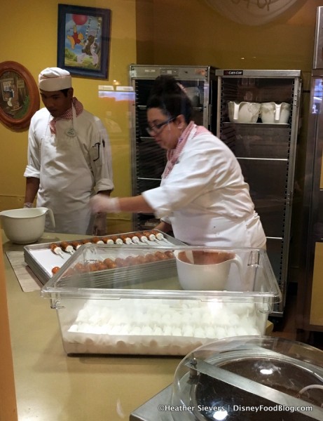 Cast Members making treats at Pooh Corner