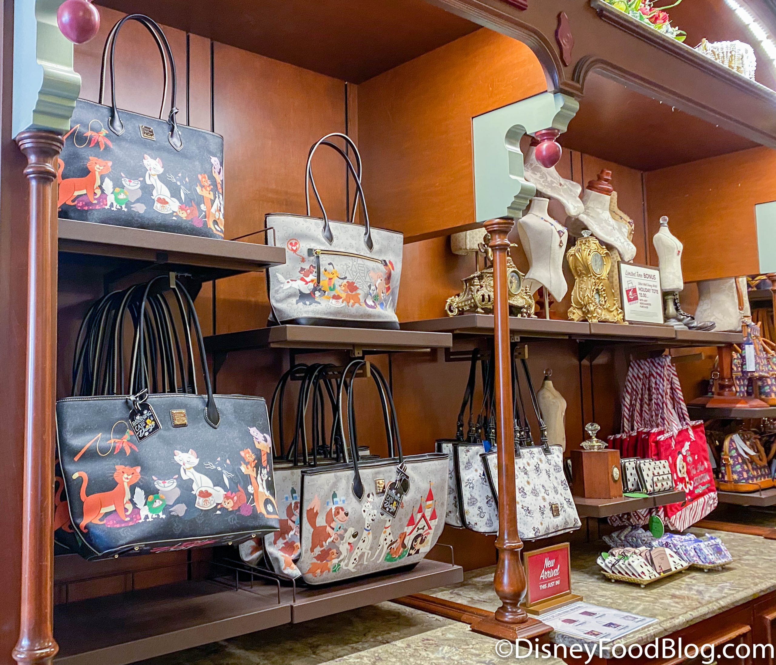 Alice in Wonderland Dooney & Bourke Bags NOW at Uptown Jewelers in Magic  Kingdom 