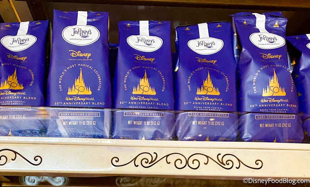 https://www.disneyfoodblog.com/wp-content/uploads/2021/09/2021-wdw-disney-world-magic-kingdom-emporium-50th-anniversary-pre-packaged-snacks-joffreys-coffee-on-the-shelf.jpg