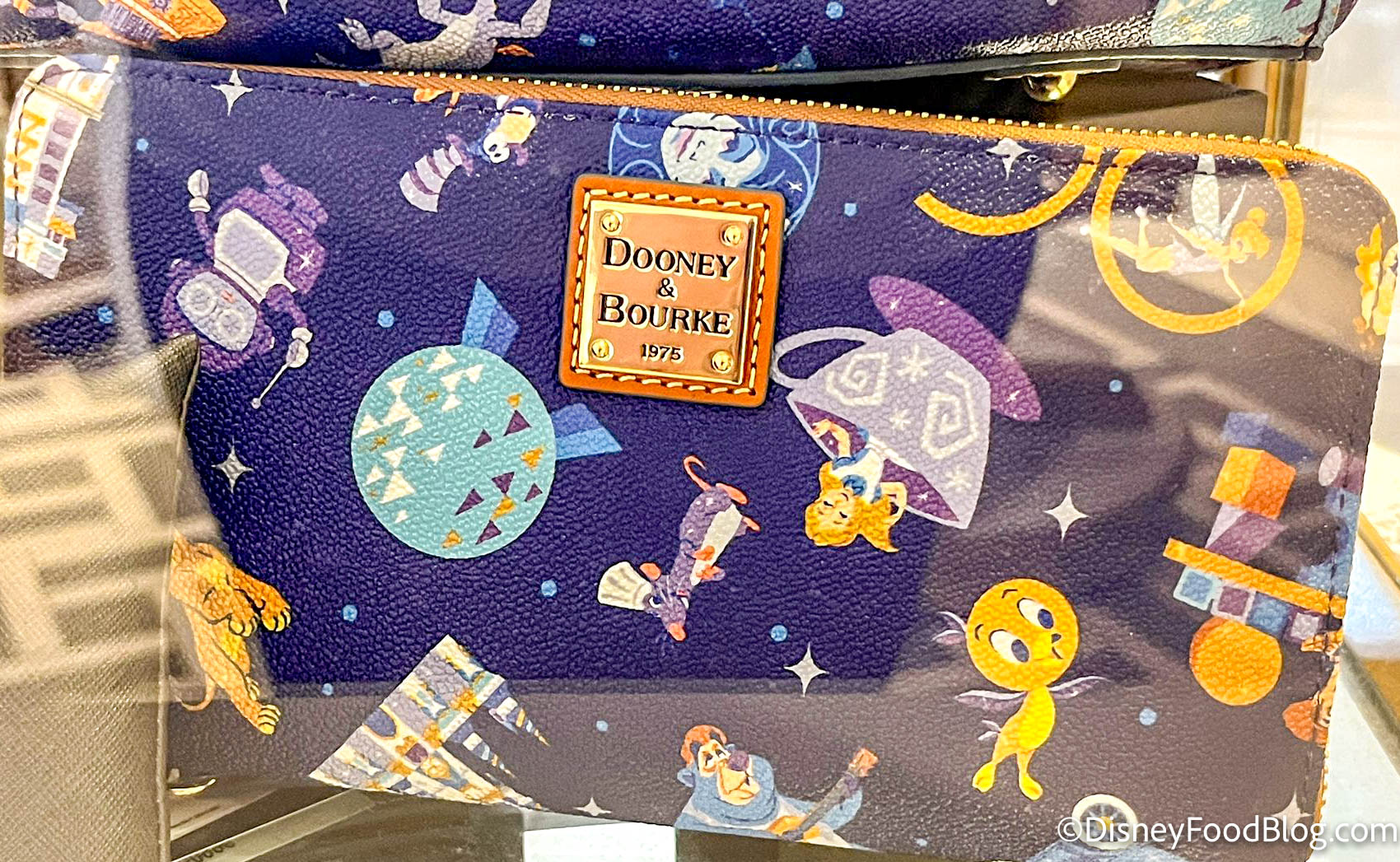 PHOTOS: New 50th Anniversary Holographic Dooney & Bourke Bags Debut at Walt  Disney World - WDW News Today
