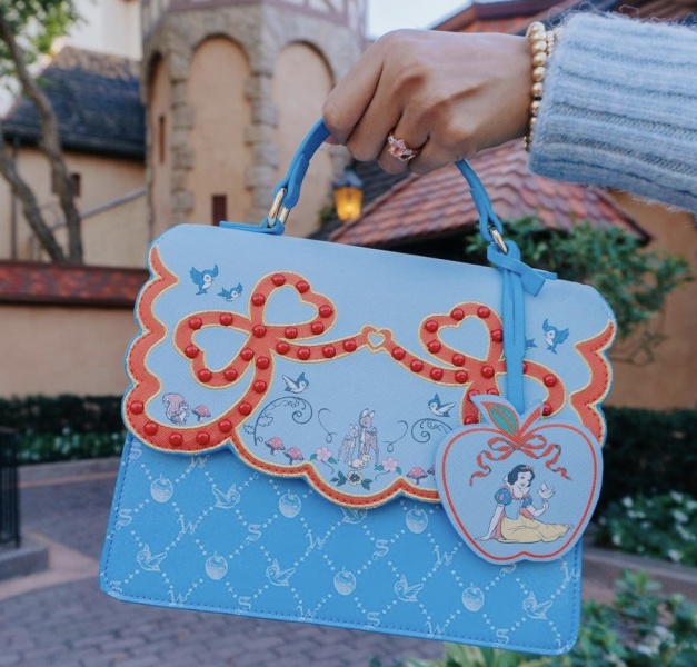 Beautifully detailed Snow White-themed Dooney & Bourke bags coming to Magic  Kingdom - Inside the Magic