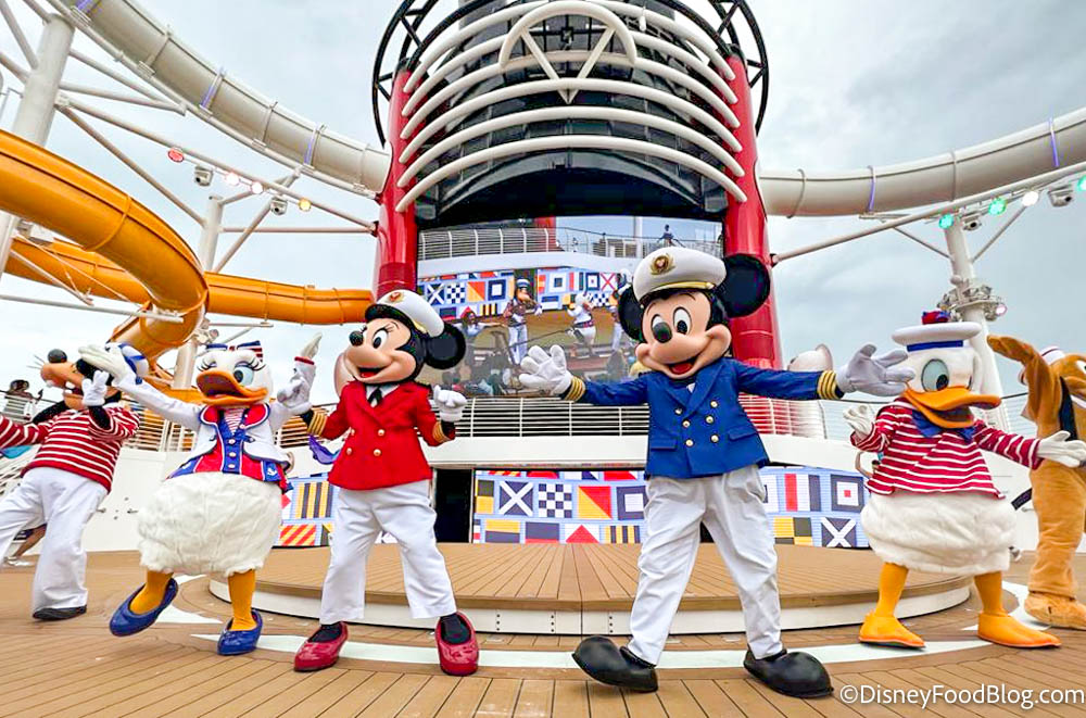 https://www.disneyfoodblog.com/wp-content/uploads/2022/06/2022-port-canaveral-disney-cruise-line-wish-ship-new-sail-away-deck-party-characters-mickey-minnie-donald-daisy-pluto-goofy-cruise.jpg