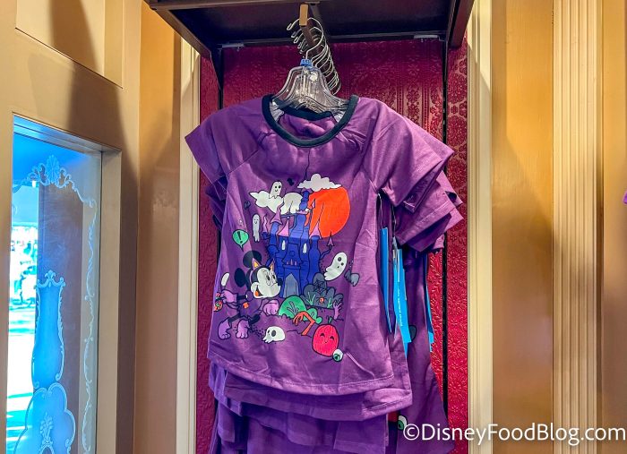 https://www.disneyfoodblog.com/wp-content/uploads/2022/09/dlr-2022-disneyland-disney-showcase-minnie-mouse-castle-halloween-kids-shirt-700x507.jpg