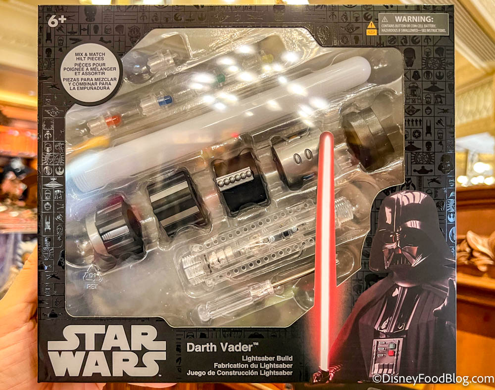 https://www.disneyfoodblog.com/wp-content/uploads/2022/10/2022-wdw-mk-whats-new-emporium-darth-vader-lightsaber-build-set.jpg