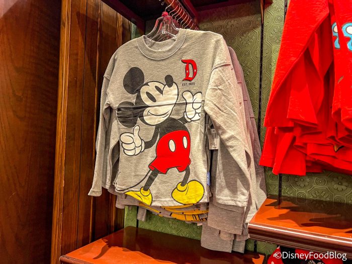 https://www.disneyfoodblog.com/wp-content/uploads/2023/01/2023-dlr-disneyland-emporium-mickey-pluto-kids-shirt-long-sleeve-700x525.jpg