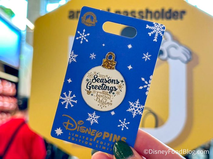 https://www.disneyfoodblog.com/wp-content/uploads/2023/11/2023-wdw-epcot-festival-of-the-holidays-creations-shop-merchandise-pin-700x525.jpg