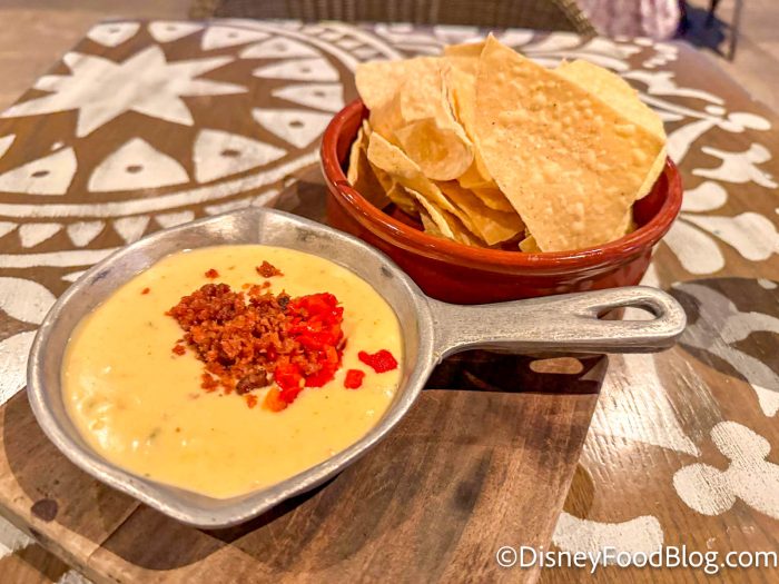 https://www.disneyfoodblog.com/wp-content/uploads/2023/11/wdw-2023-disneys-coronado-springs-resort-three-bridges-bar-and-grill-white-queso-dip-changed-review-5-700x525.jpg