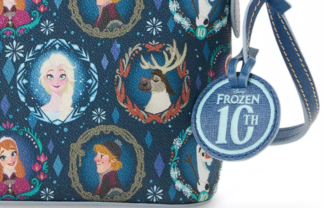 https://www.disneyfoodblog.com/wp-content/uploads/2023/12/2023-shopdisney-dooney-bourke-frozen-10th-anniversay-crossbody-bag-zoomed.png